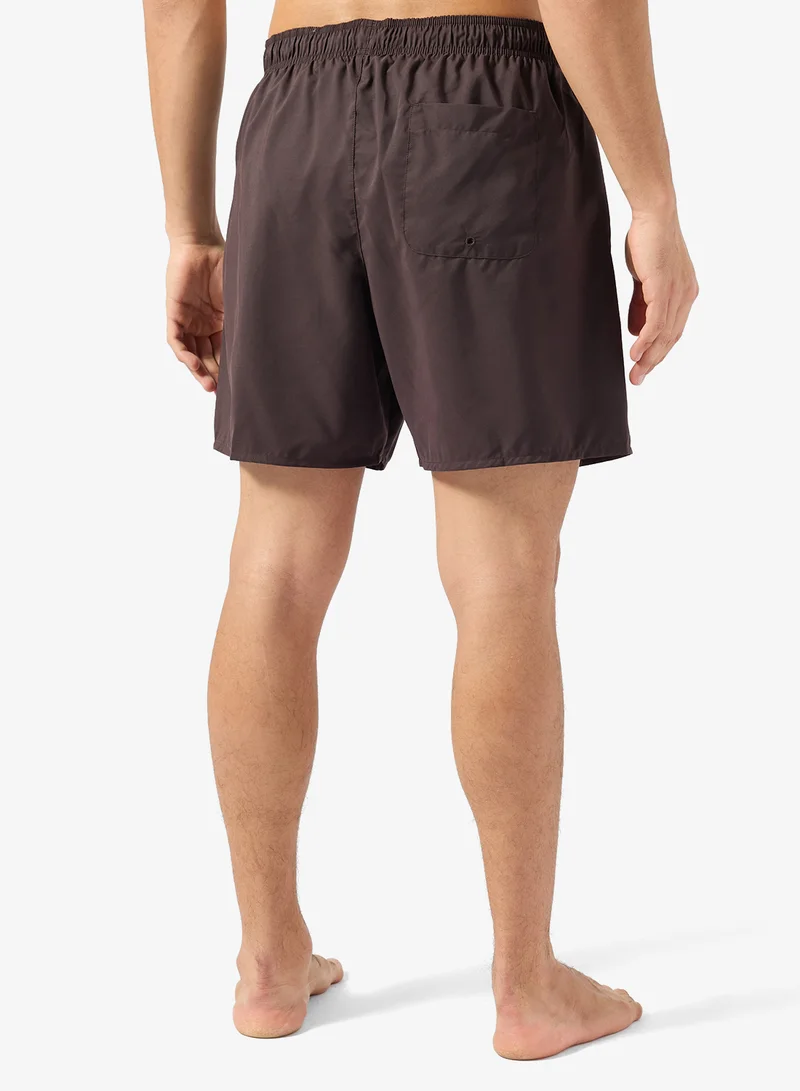 LACOSTE  Monochrome Swim Trunks for Men | Best Price UAE